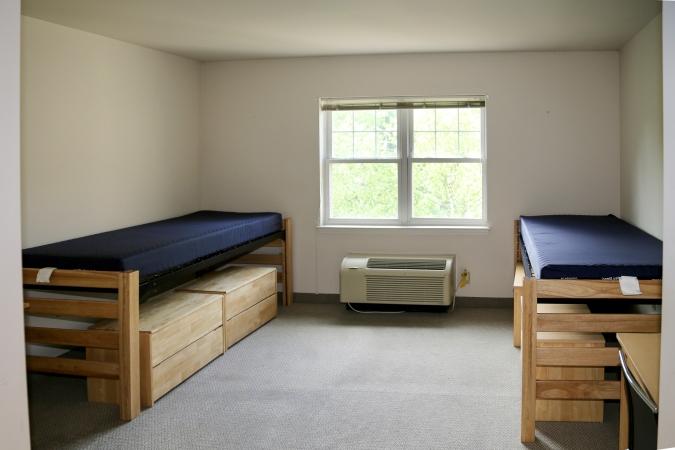 Delaney Hall Residence dorm room with two beds and a large window